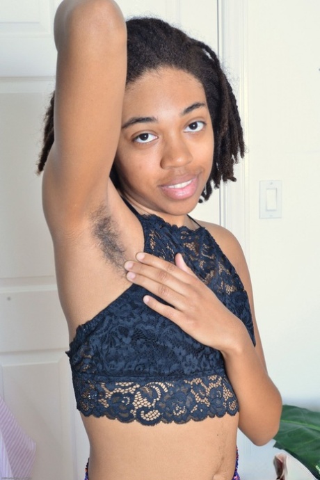 Cute amateur ebony Olivia Green shows her hairy armpits and furry crotch