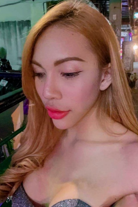 Blue-eyed Asian ladyboy shows off her alluring figure and poses provocatively