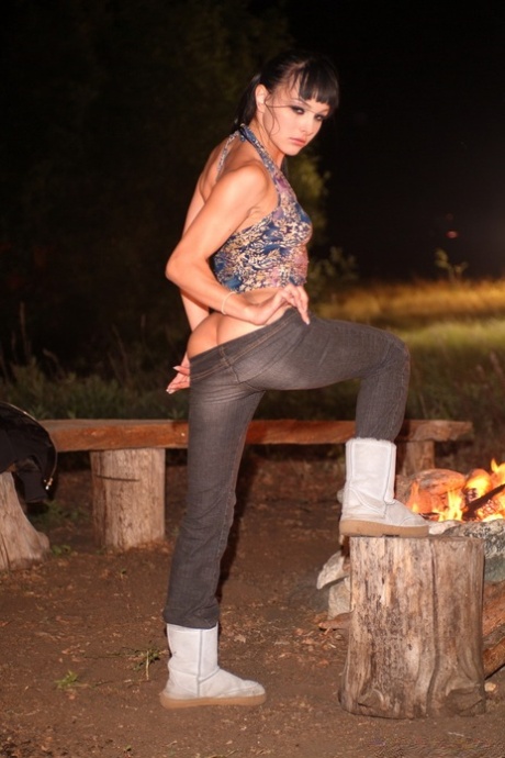 Brunette pornstar shows her body & gets screwed doggystyle beside the campfire