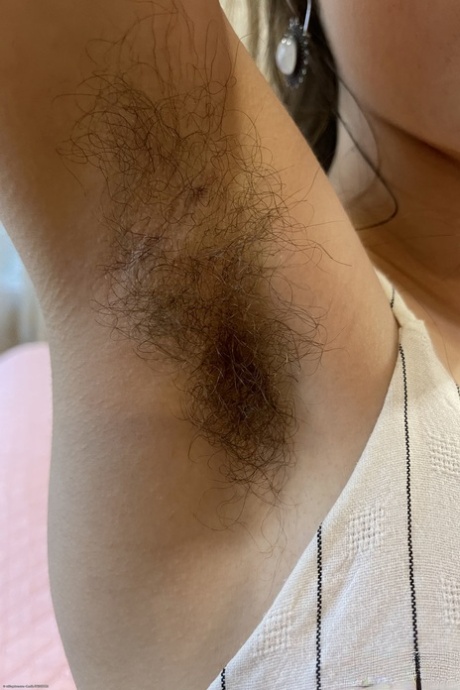 Petite amateur Sia Wood exposing her unshaven armpits & hairy holes