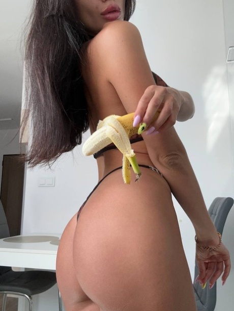 Glamorous OnlyFans chick Kris Top poses in her hot lingerie & eats a banana