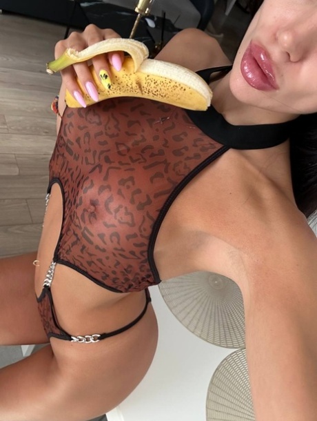 Glamorous OnlyFans chick Kris Top poses in her hot lingerie & eats a banana