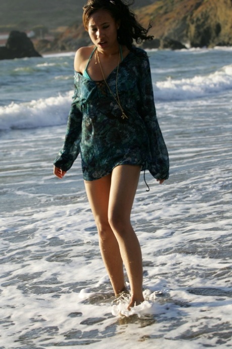 All-natural teen model Toni walking in her sexy outfit on the sandy beach