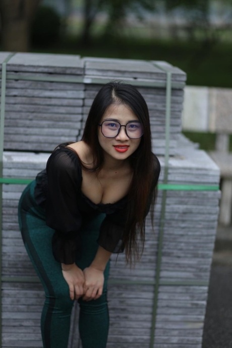 Breathtaking Asian model with glasses Elena poses in her sexy outfit