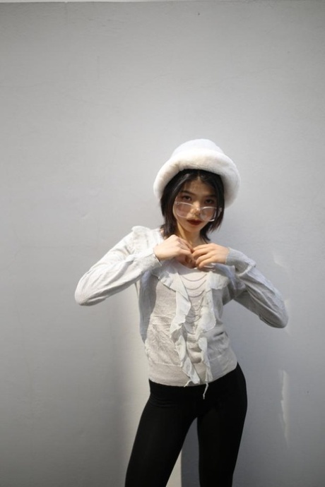 Cute Asian babe with glasses and hat Irena posing in her black & white outfit