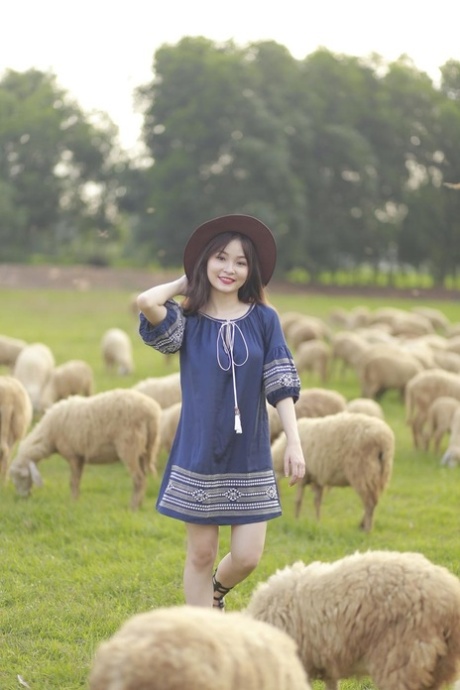 Beautiful Asian countryside girl poses in her hot outfit at the farm