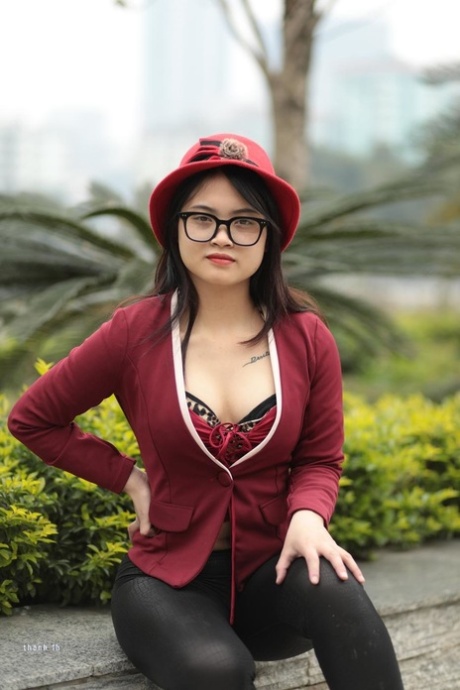 Nerdy Asian babe with red lipstick Julia flaunting her sexy cleavage in public