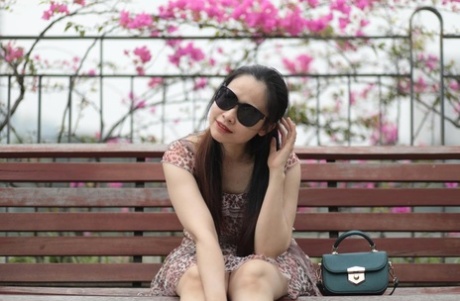 Gorgeous Asian girl with sunglasses Katrina posing in her summer dress outside