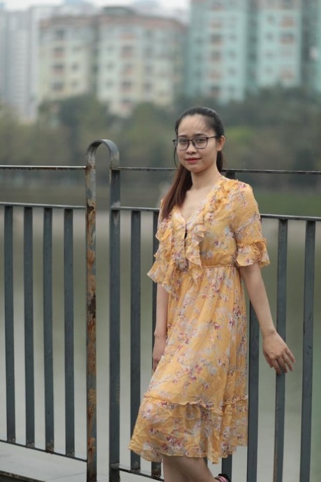 Beautiful Asian model with glasses Katrina poses in her summer dress in public