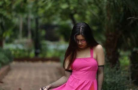 Beautiful Asian model Natalia posing in her hot pink dress in public