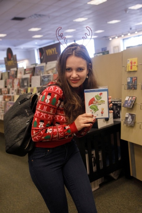 Lusty teen Shelley Fox lifts her Xmas sweater in public and shows her big tits