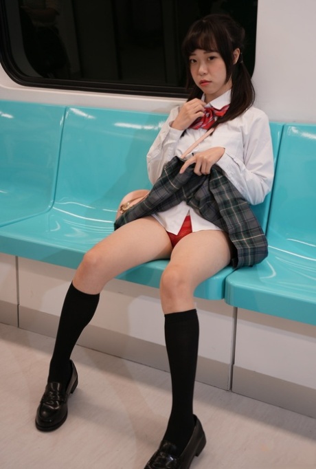 Asian schoolgirl Yuli has doggystyle sex with a senior on the train