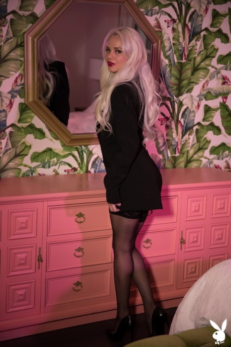 Blonde centerfold Elsa Jean does a sexy striptease wearing black lingerie