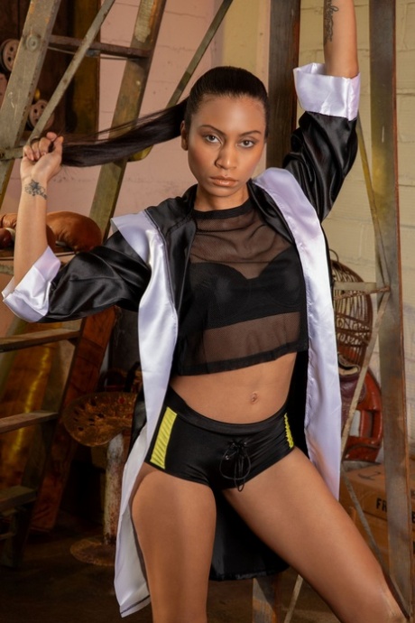 Sexy ebony with a ponytail Fatima Kojima shows off her firm figure and poses