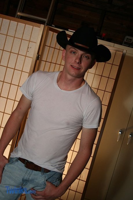 Gay cowboy Ethan Cross strips completely naked & shows off his shaved dick