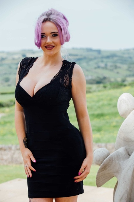 Dazzling British MILF Jasmine James flaunting her fake tits in nylons outdoors