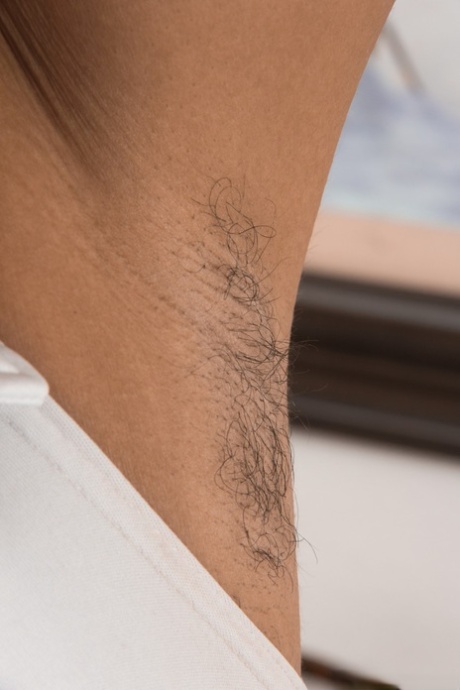 Pretty ebony Divine shows her hairy armpits & spreads her furry bush