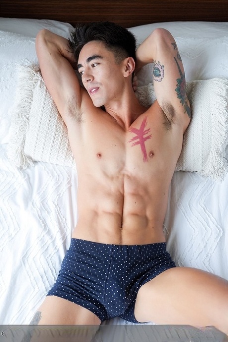 Black hunk Braxton Cruz and muscular Asian gay Cody Seiya fuck hard on a bed