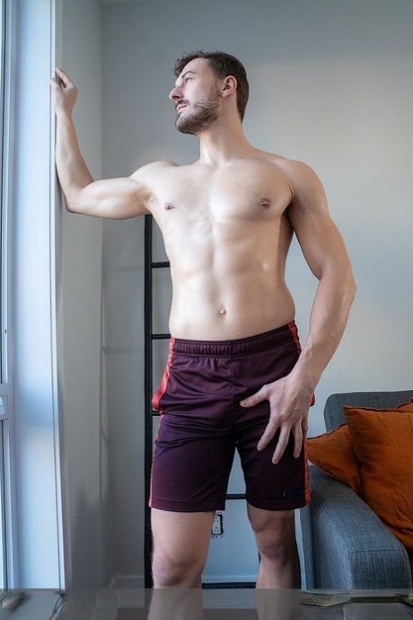 Gay amateur Felix Trainor strips his shorts, shows his lean body & masturbates