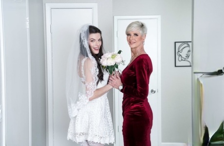 Bride Fiona Frost & her mom Foxxxy Darlin swap cum after fucking in a 3some