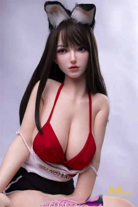 Japanese sex doll Ophelia undressing and exposing her big tits and ass