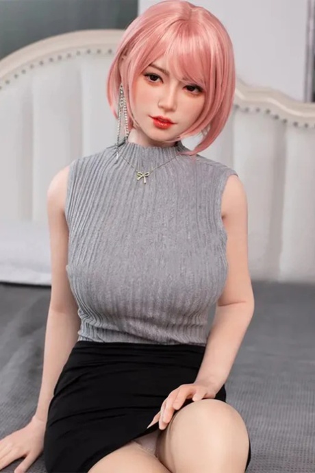 Pink-haired silicone sex doll Nan posing in her hot outfit and heels