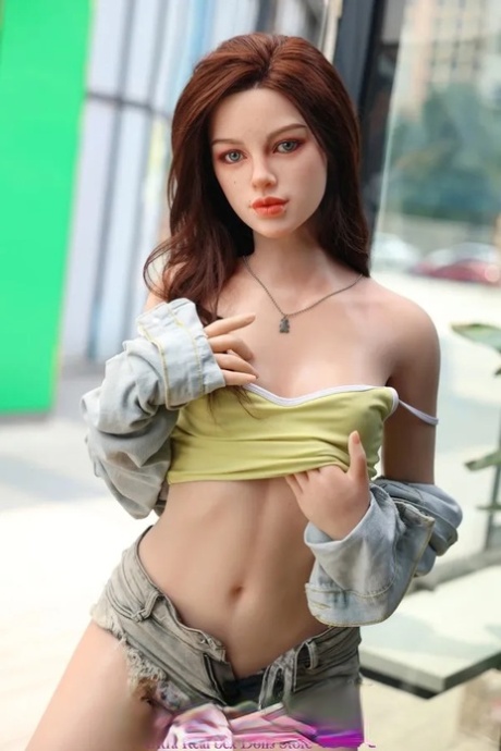 Realistic sex doll babe Hedy exposes her small breasts and sweet ass