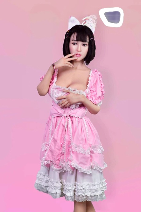 Tiny Asian sex doll Lily poses in her pink dress & shows her tits, pussy & ass