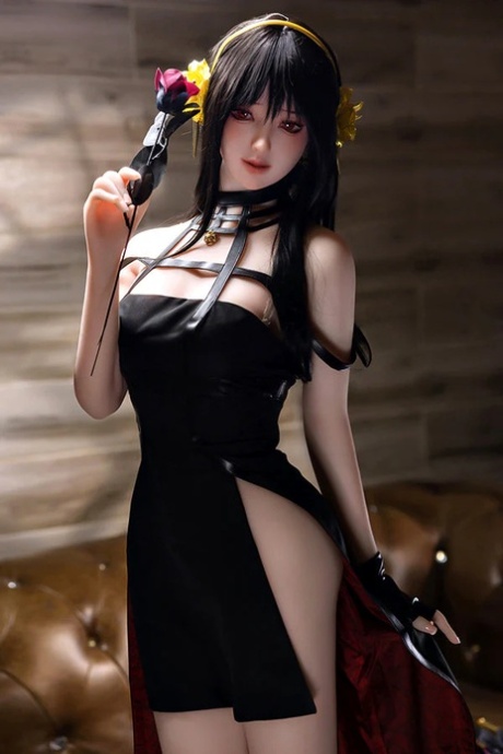 Pretty sex doll shows her perfect petite body in a black dress & while naked