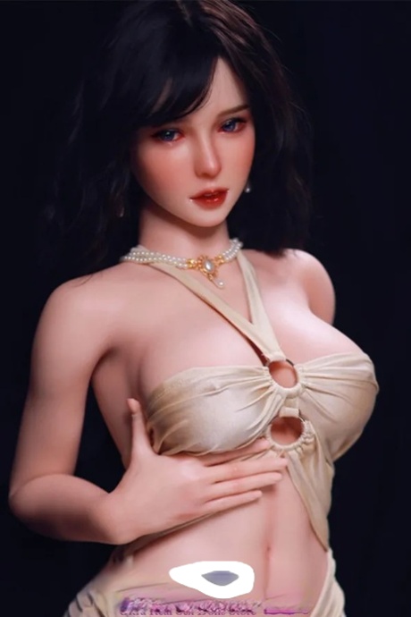 Dark-haired sex doll Nancy posing in her provocative white dress