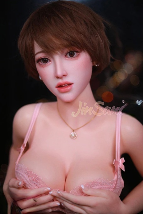 Hot Korean sex doll posing in her sexy lingerie and tight dress in a solo