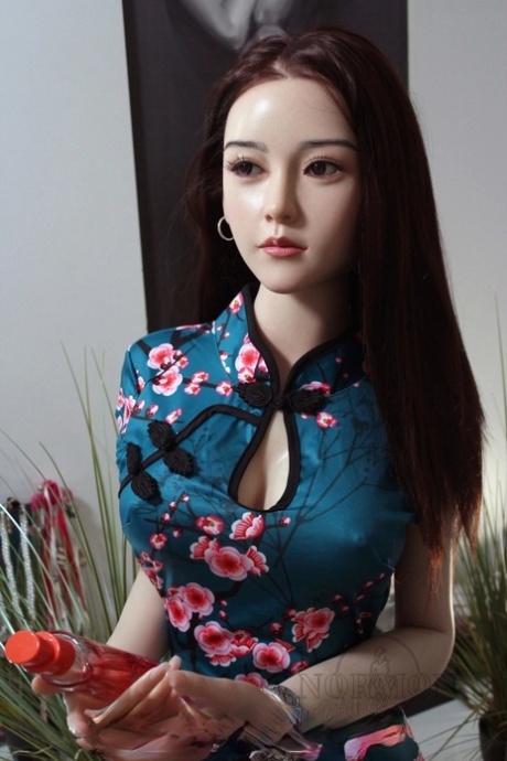 Petite Asian sex doll Xiu posing in her lovely traditional outfit in a solo