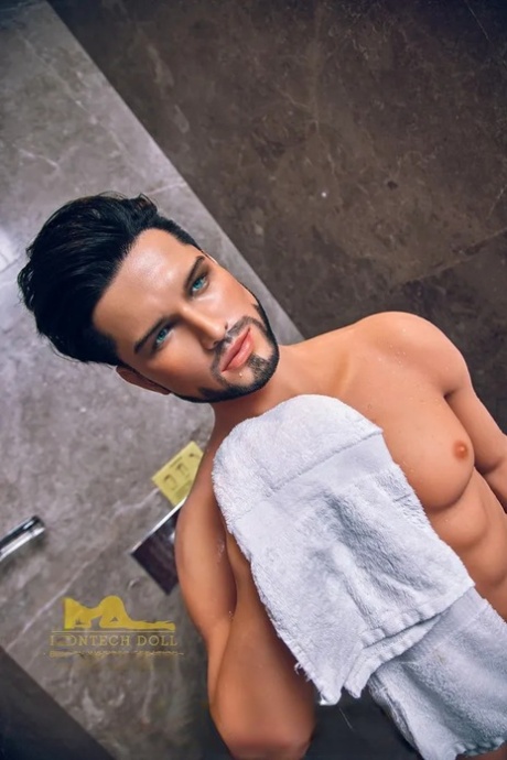 Bearded male sex doll Gunnar shows off his muscles and big long dick