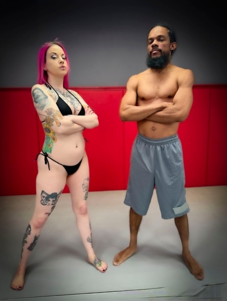 Inked redhead Lady Lazra gets her pussy blacked after a wrestling match