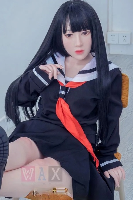 Beautiful Asian schoolgirl sex doll shows her petite naked body