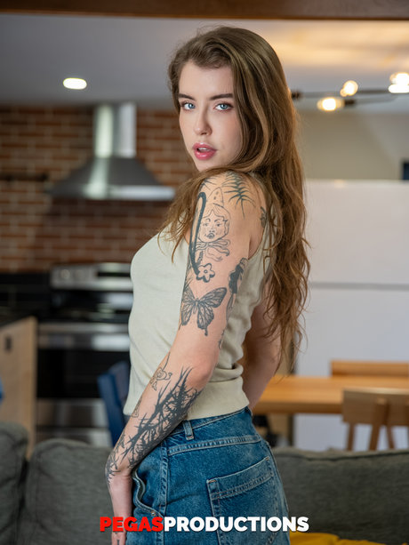 Sexy tattooed babe Eden Ivy shows her sweet tiny tits and her trimmed bush