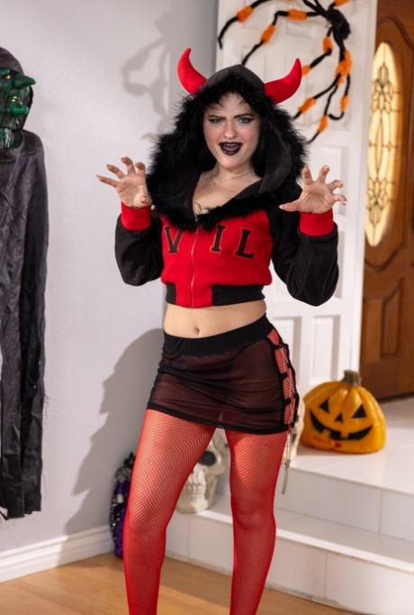 Devilish teen Imani Valor strips and blows a hard dick on a Halloween