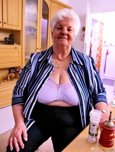 Old granny Natascha strips her clothes off and shows her fat body & saggy tits