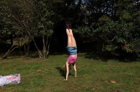 Acrobatic teen Addee Kate reveals her skinny body & toys her snatch outside