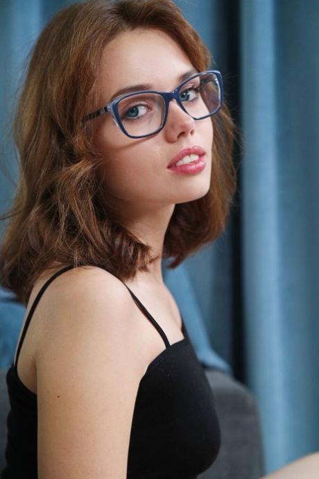 Nerdy teen in a bodysuit Keira Blue exposes her tight cunt in a solo